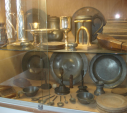 7  pewter plates and wooden trenchers