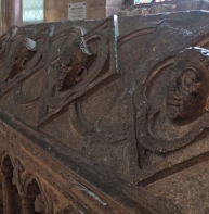 large carved heads on tomb of Archbishop Hubert Walter (d 1205)