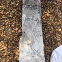 county boundary stone 4A lying in a garden