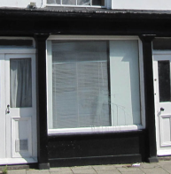 Early 1800s shop front with four plain pilasters