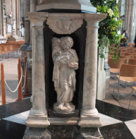 Evangelist symbol – Matthew with an angel on the cathedral font  