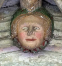 9  woman's head with garland - cloister south walk - early 15th century