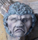 7  head with garland - west porch - early 15th century