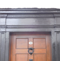 Small modillions in cornice over door of 18 Best Lane