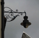 wall bracketed lamp in The Friars - with blackened glass