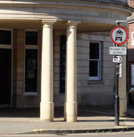 Doric columns at street level - in spaced pairs