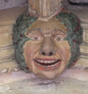 2  head with garland - cloisters south walk - early 15th century