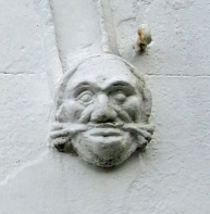 Coadestone foliate head on right hand side of the doorway