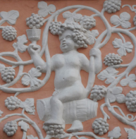 One of two large putti frolicking in grape vines - Queen Elizabeth Guest Chamber