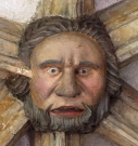 4  head with garland - cloisters south walk - early 15th century