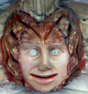 17  head with gold and red surround - cloisters south walk? - early 15th cent