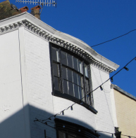Shallow bay window - corner of St Margaret's Street and Hawk's Lane