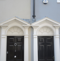 pair of adjacent open pediments in Best Lane