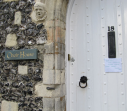 1  front door with stone chorister's head