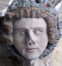 6  head with garland - west porch - early 15th century
