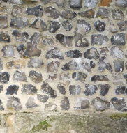 modern coursed flintwork in Westgate Grove