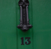 cast iron combined bat over letter box and knocker - St John's Lane
