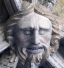 7  head with neat hair but no greenery - west porch - early 15th century