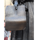 4.  Chaucer holds a vellum copy of the opening  page of the Canterbury Tales